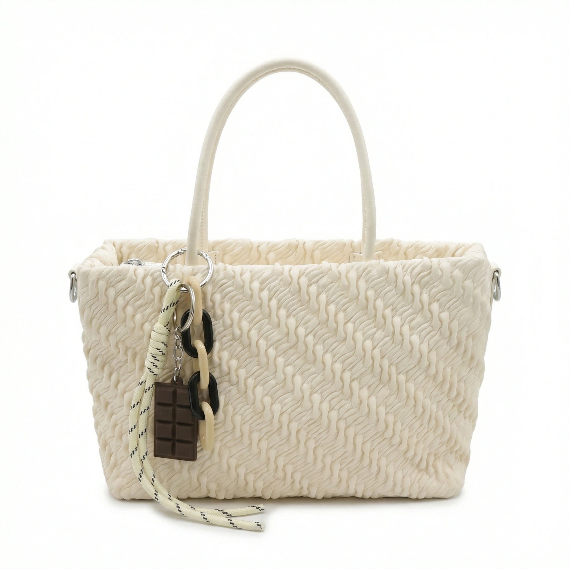 TKN Mousse cream handbag featuring textured ruched vegan leather, matte monochromatic chain charm, and dimensions of 24x16x9cm