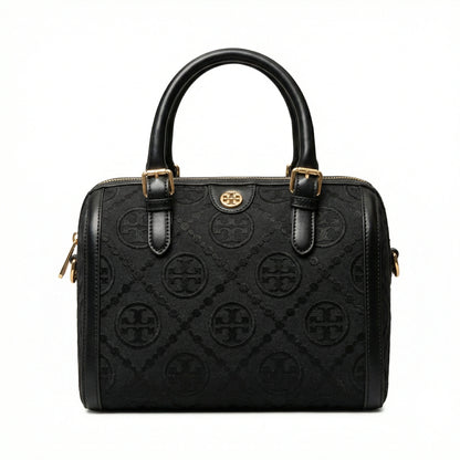 Legacy — A structured Boston bag with rounded top handles and an all-over pattern.