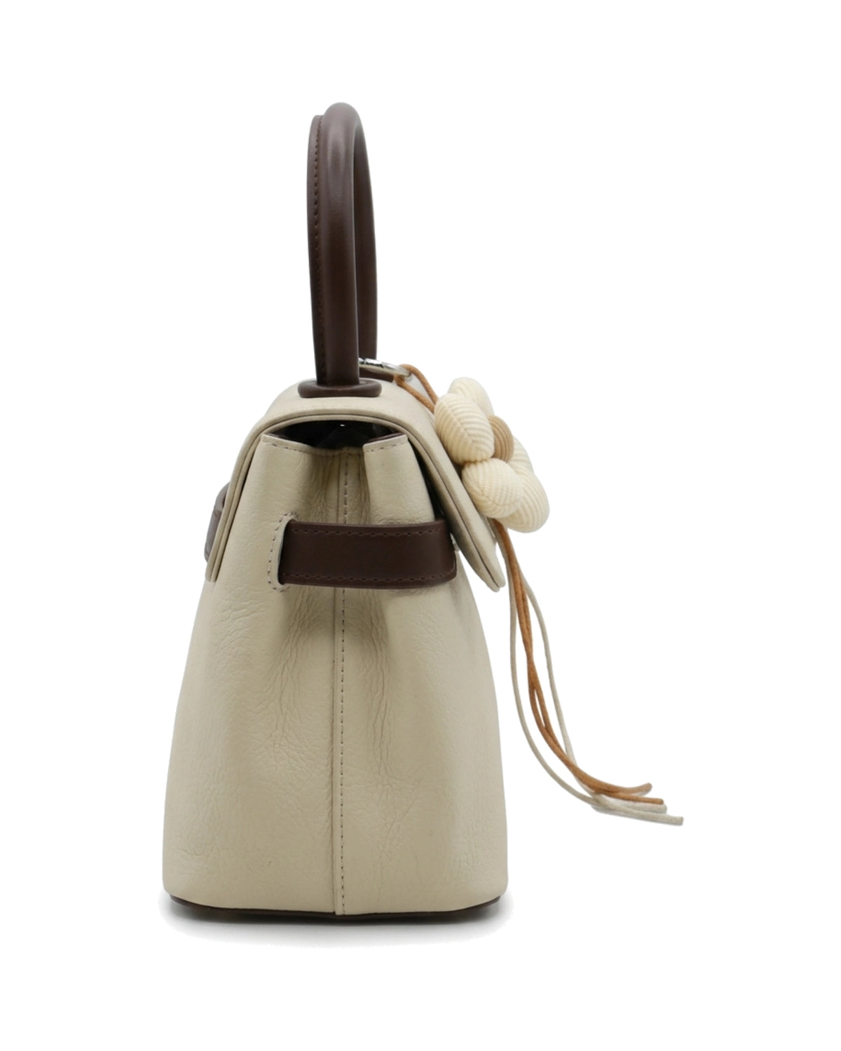 TKN Blossom — Cream — flap-front body — side profile.