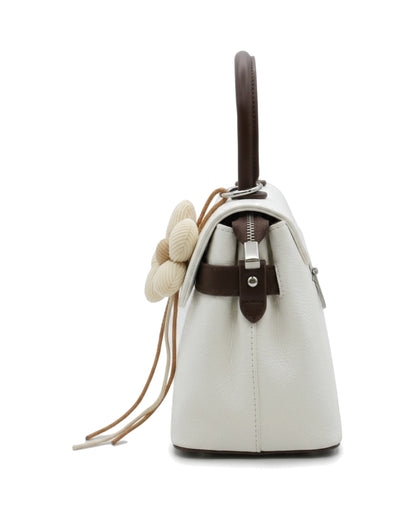 TKN Blossom — White — flap-front body — side profile.