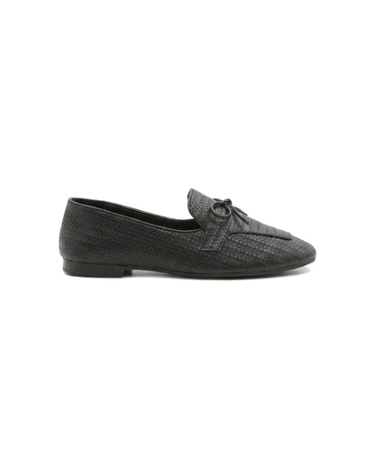 TKN Camille black woven-effect loafer with a tonal bow and piped vamp panel — side view.