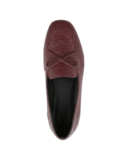 TKN Camille burgundy woven-effect loafer with a tonal bow and piped vamp panel — top view.