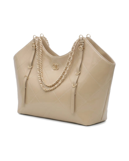 TKN Cascade — Beige — dipped top outline — front three-quarter view.
