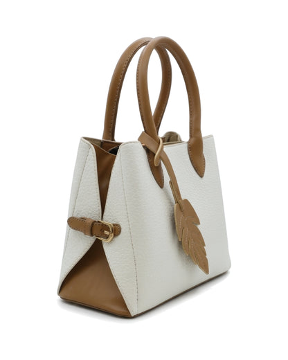 TKN Folio — Cream / Tan — tapered trapezoid silhouette — front three-quarter view.