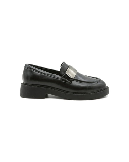 TKN Margot black chunky loafer with a silver-tone metal plaque — side view.