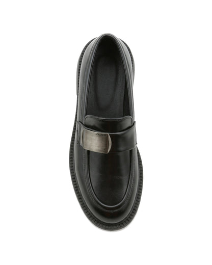 TKN Margot black chunky loafer with a silver-tone metal plaque — top view.