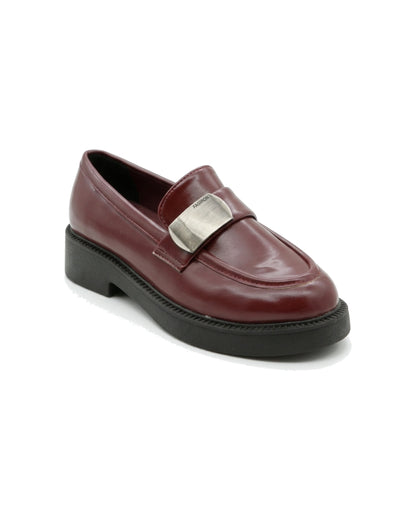 TKN Margot burgundy chunky loafer with a silver-tone metal plaque — front three-quarter view.
