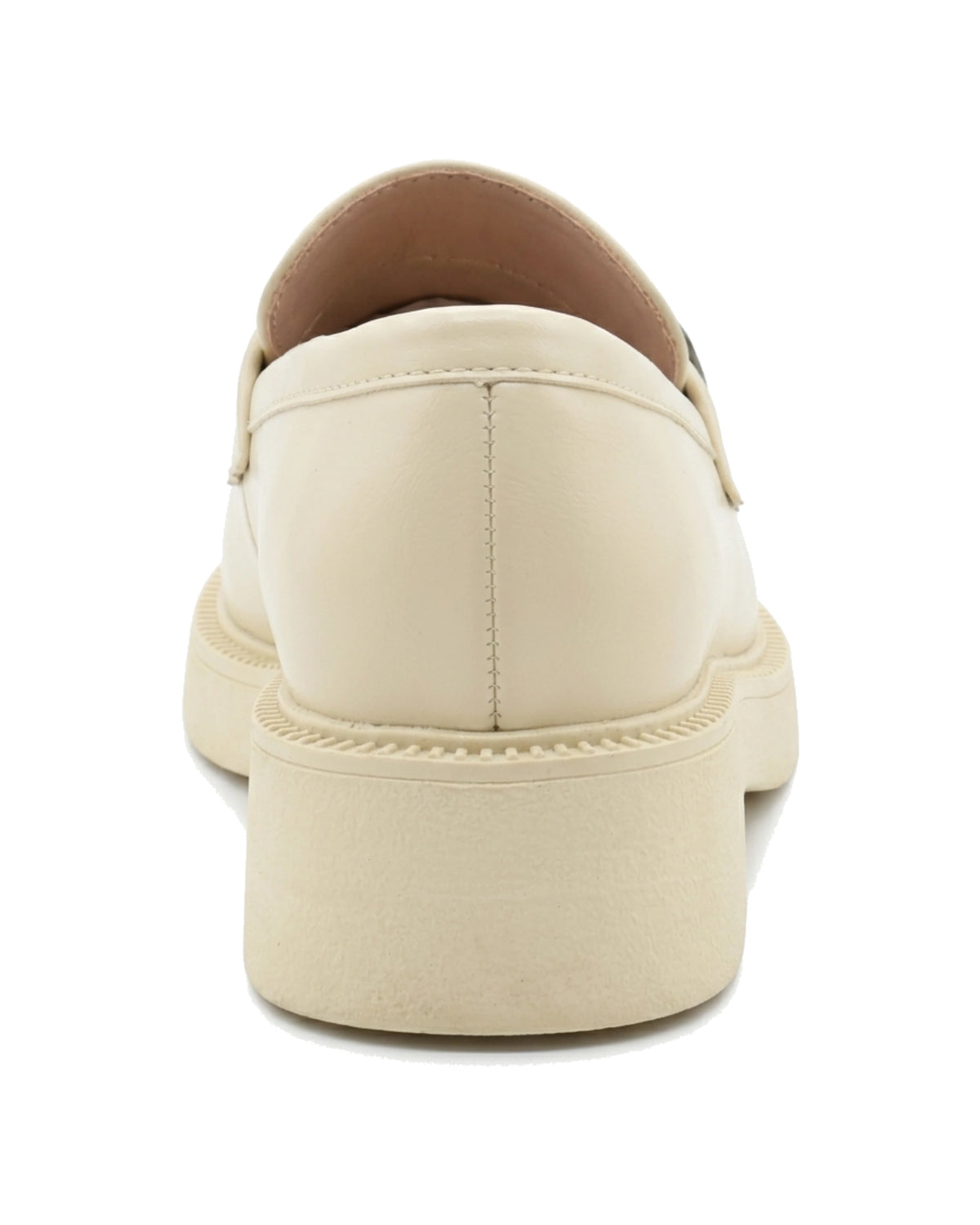 TKN Margot cream chunky loafer with a silver-tone metal plaque — back view showing the heel.