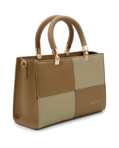 TKN Mosaic — Tan / Beige — square-looking structured silhouette — front three-quarter view.