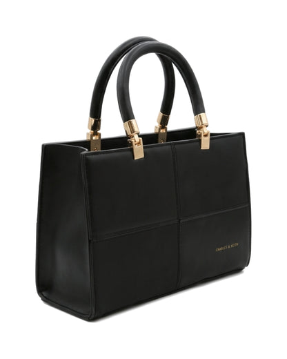 TKN Mosaic — Black — square-looking structured silhouette — front three-quarter view.