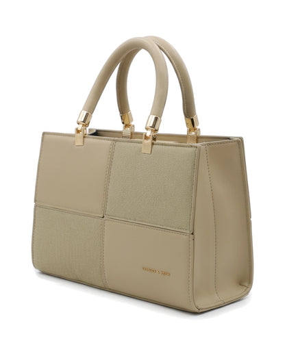 TKN Mosaic — Beige — square-looking structured silhouette — front three-quarter view.