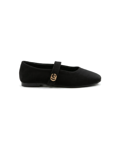 TKN Noelle black matte Mary Jane flat with a rounded toe and gold-tone interlocking ring detail — side view.