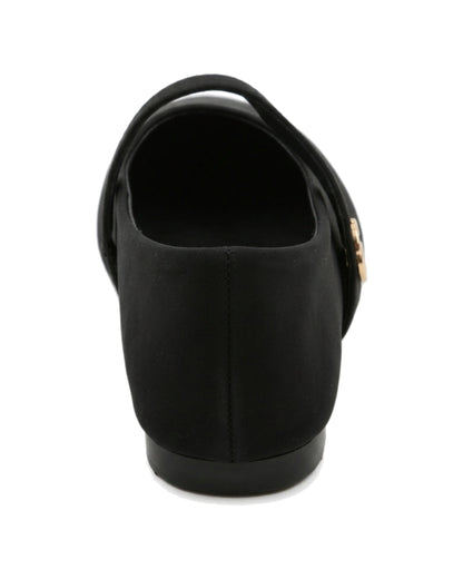 TKN Noelle black matte Mary Jane flat with a rounded toe and gold-tone interlocking ring detail — back view showing the low heel.