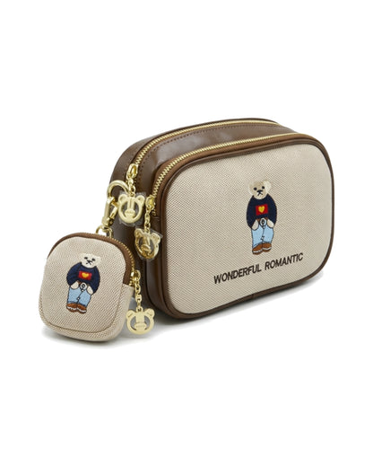 TKN Sidekick — Cream / Brown — rounded rectangular body — front three-quarter view.